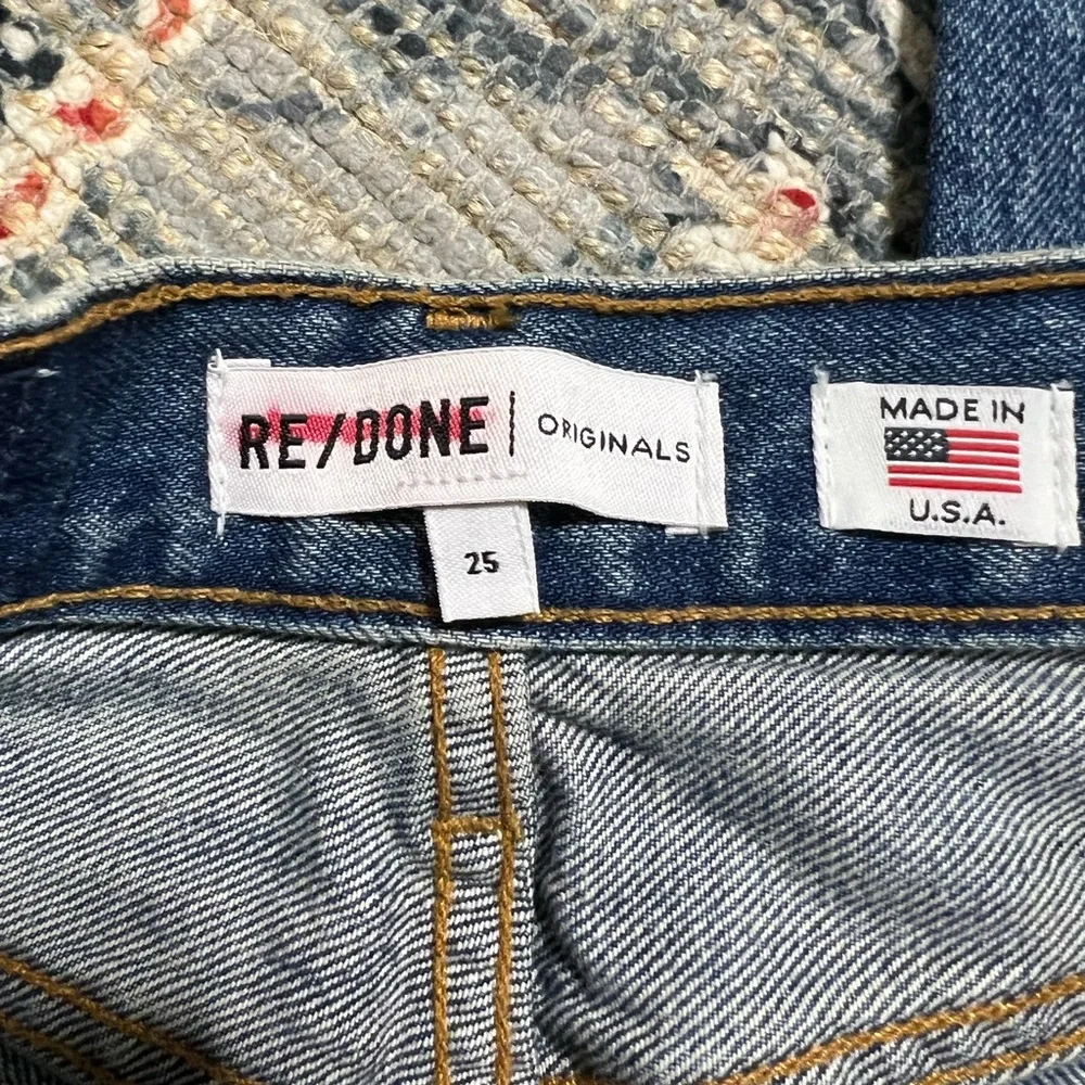 Re Done high rise stove pipe raw frayed hem denim jeans
